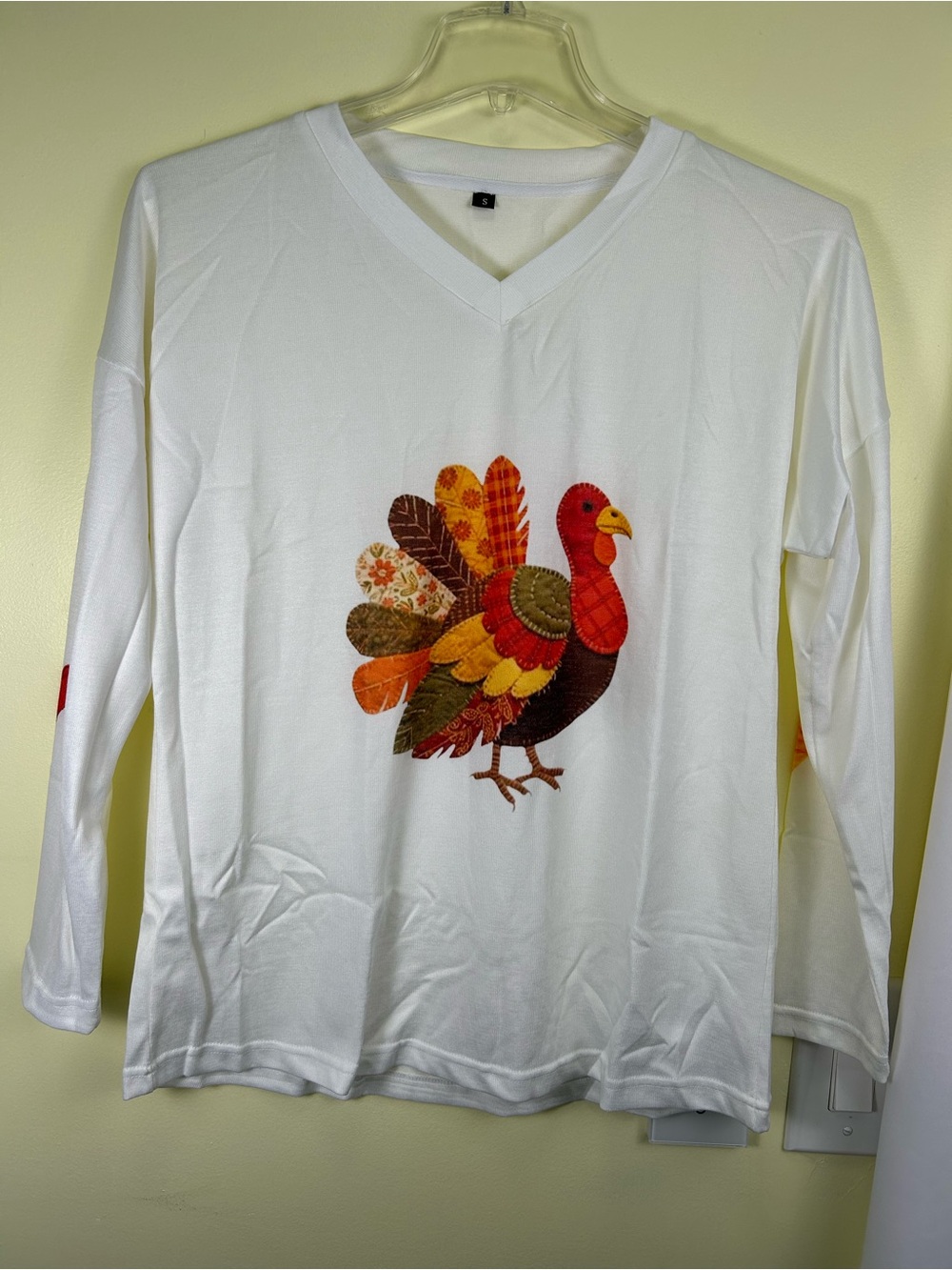 White Long-Sleeve V‑Neck Tee with Colorful Turkey Applique